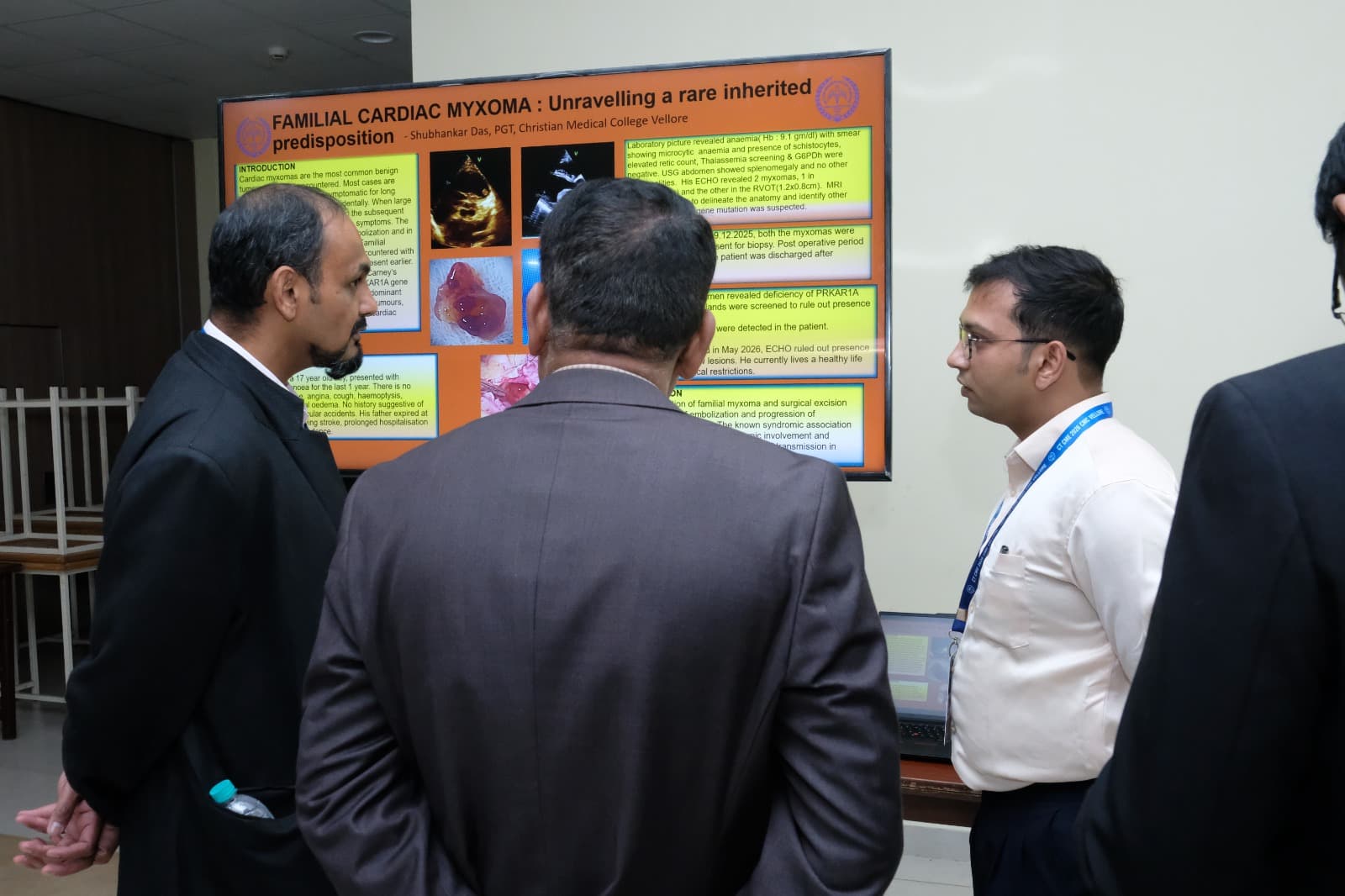 Dr Mohammad Idhrees listening to a trainee present a research poster during the poster session at IACTS CT CME 2026